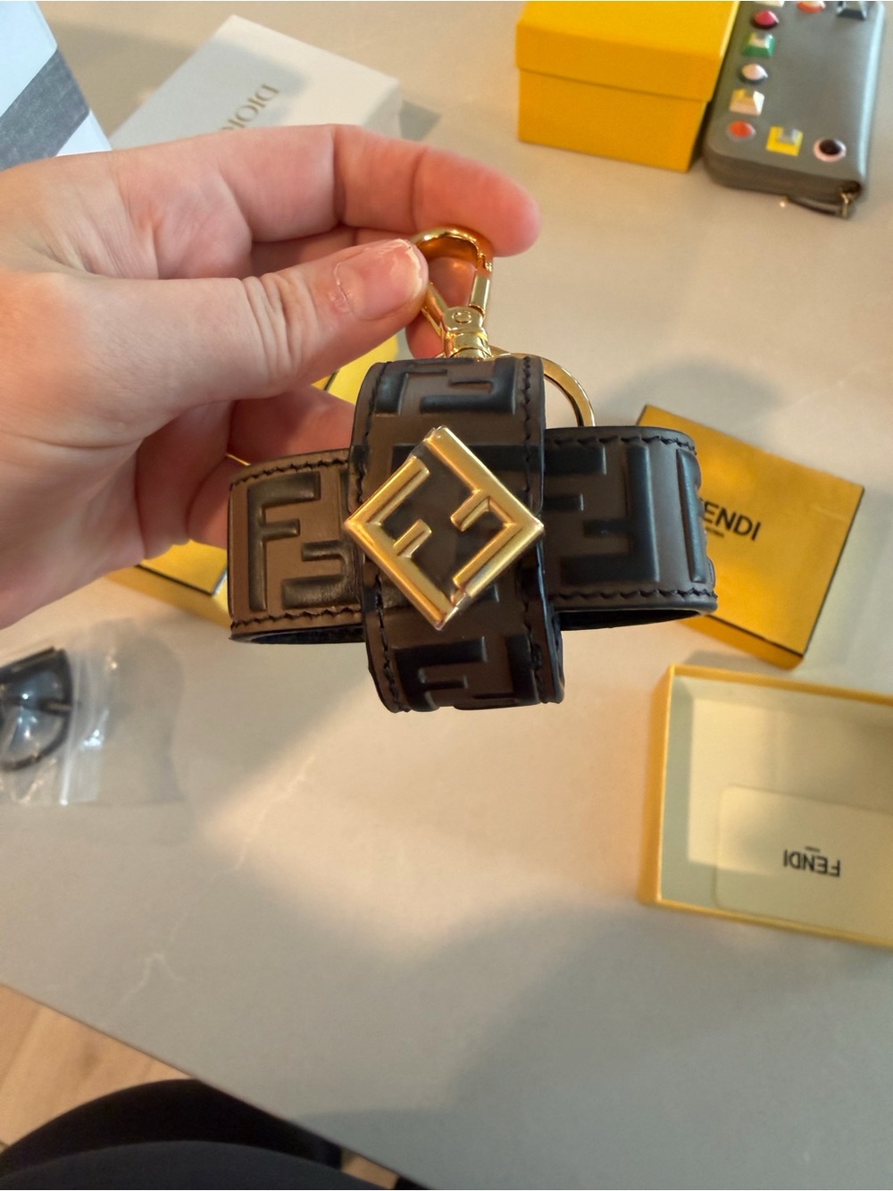 Fendi Black Embossed FF Leather Airpod Holder with Gold Logo